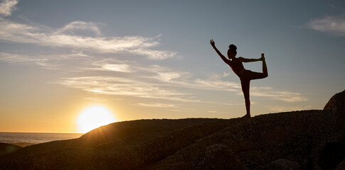 Woman, silhouette or yoga on sunset beach rocks in relax fitness, training and exercise for mental...