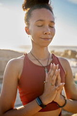 Yoga, meditation and praying black woman at beach for spiritual, wellness and healing with zen,...