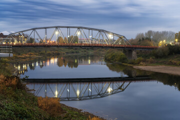 Automobile bridge across the river Sylva (Kungur, Russia) in the evening.