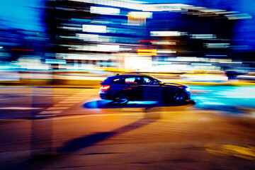 Fototapeta na wymiar Citylights with car in speed race 