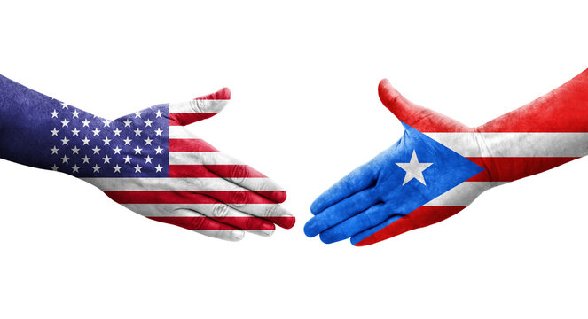Handshake between Puerto Rico and USA flags painted on hands, isolated transparent image.