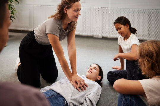Teacher giving first aid training