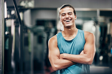 Fitness, gym and happy portrait of personal trainer man ready for workout coaching. Training, wellness and exercise coach confident with arms crossed at professional athlete health club. - Powered by Adobe