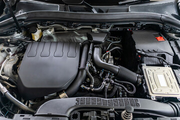 Fototapeta na wymiar modern car engine under hood close up detail