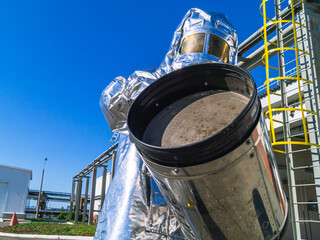 Elimination of accidents and fires at petrochemical industry facilities. Fireman's protective suit to protect against high temperature in case of fire. Emergency situation at the oil storage facility.