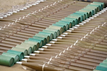 Almaty, Kazakhstan - 04.14.2022 : Grenades for a hand grenade launcher are laid out in a row at military exercises.
