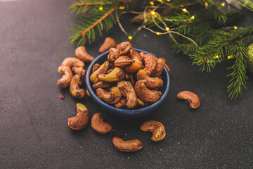 cashew nuts close-up in a bowl on a dark background selective focus