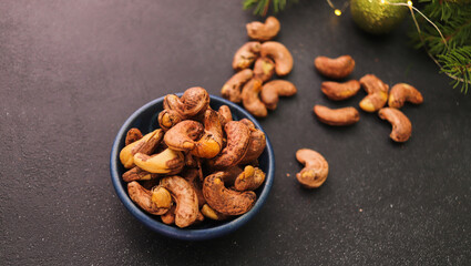 cashew nuts close-up in a bowl on a dark background selective focus