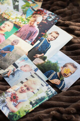 children's photo close-up shots on a soft blanket selective focus, family memories