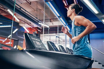 Fitness, man and running on treadmill for workout, exercise or cardio training for endurance at the...