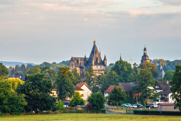 German fairytale castle in summer landscape. Castle Romrod in Hesse, Vogelsberg, Germany. Beautiful view on castle. - obrazy, fototapety, plakaty