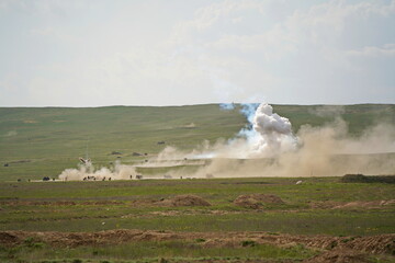 Fototapeta na wymiar Almaty, Kazakhstan - 04.14.2022 : The active phase of military exercises with explosions at the landfill.