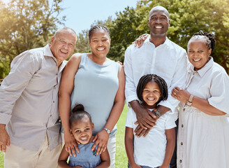 Portrait of happy black family with smile in park, garden or outdoor picnic venue. Men, women and kids together on grass at family event and making memories, generations with girl children and couple