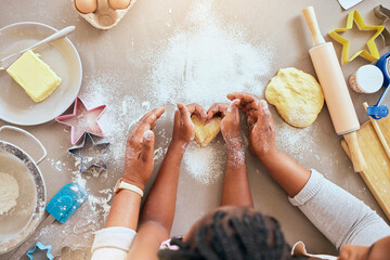 Black woman, child hands or kitchen baking of heart shape pastry, house cookies or dessert biscuit scone in family home. Top view, mother or girl cooking food in help, support or learning cake recipe - obrazy, fototapety, plakaty