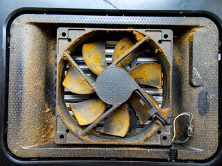 A dirty cooler fan. Close-up