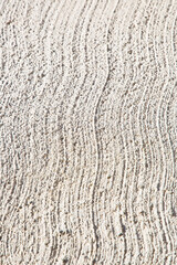New concrete roadbed background made with cement and stone gravel with a striped finish