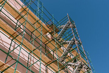  looking up a green scaffolding 