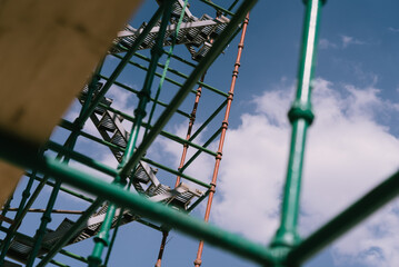  looking up a green scaffolding 