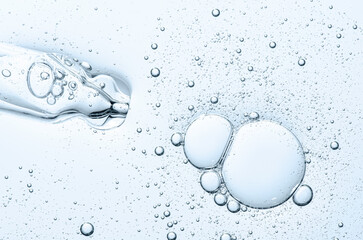 The texture of a cosmetic serum with a pipette closeup. Macrophotography