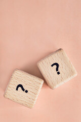 Question cubes on beige background