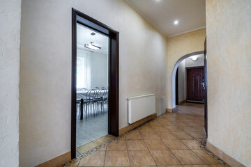 long empty corridor in interior of entrance hall of modern apartments