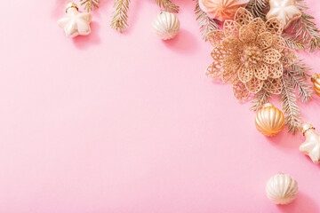 Fototapeta na wymiar golden christmas decorations on pink background