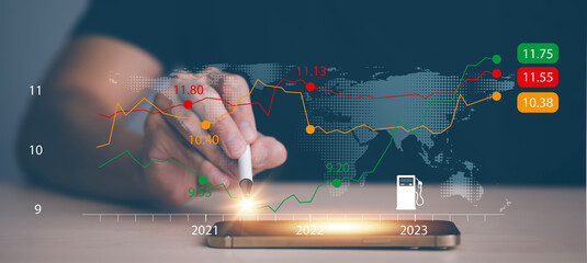Oil energy graph of the world market, impact on the economy concept,Hand touch chart with the indicator on the oil price slide at gas station, fluctuations in oil prices and exchange trade.