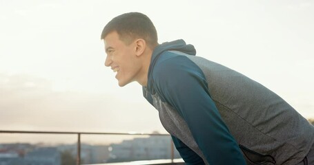 Fitness, tired man and break in the city after running exercise, training or workout in the outdoors. Exhausted man breathing from intense sports run for healthy cardio in recovery for energy outside