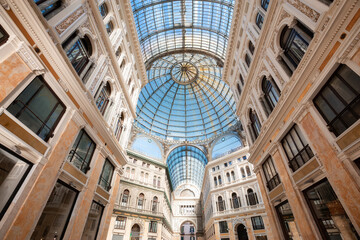 Historic public shopping gallery with old Architecture and Glass Arch Ceiling, Galleria Umberto I. Naples, Italy.