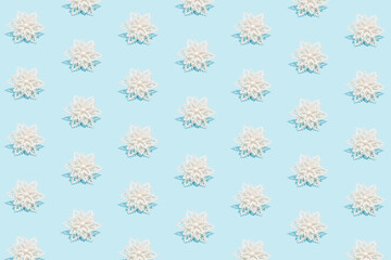 Winter pattern made of snowflakes on blue background. Winter concept. Flat lay.