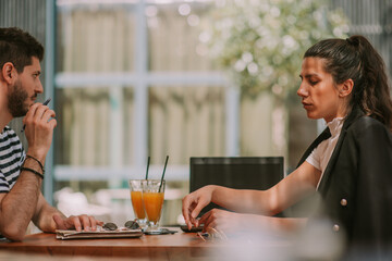 Close up of business partners at the cafe
