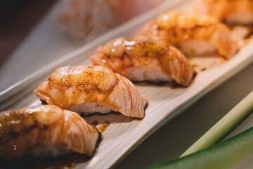 Salmon sushi is a popular fish dish. sushi is a street food of japan and new business in the world.