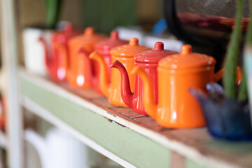 Colorful teapots on the breakfast table