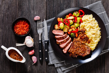 beef steak with potato mash and roasted vegetables