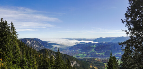 Fototapeta na wymiar dense white fog in a deep valley view from the mountain panorama