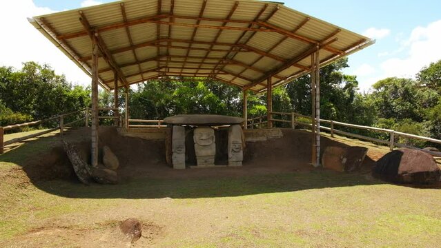 Roofed Statue Alto de las Piedras at San Agust&iacute;n Archaeological Park, pan, wide shot