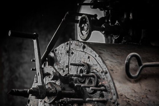 Details of old metal train cars and locomotives.