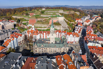 Klodzko town hall and twierdza klodzka aerial shot in autumn.