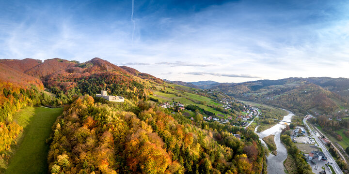 Rytro Castle in autumn, Poprad river valley, Poland, aerial drone panoramic shot.