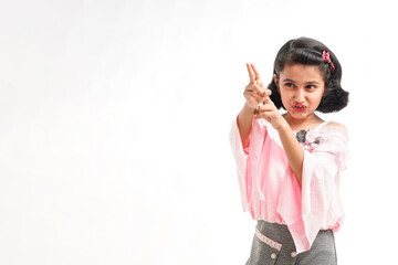 Fototapeta premium Cute indian little girl giving expression on white background