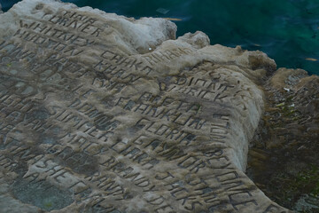 celebrity celebrities names graffiti on saint peter pools Malta rock formation