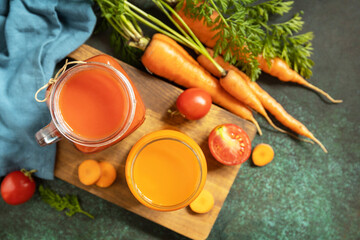 Vitamins drinks juice carrot and tomato, healthy lifestyle. Tomato and carrot juice in a glasses...