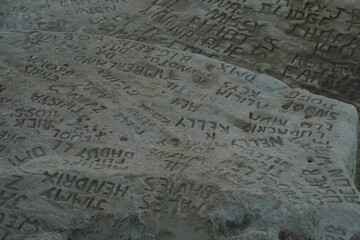 celebrity celebrities names graffiti on saint peter pools Malta rock formation