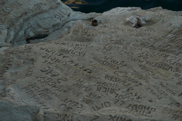 celebrity celebrities names graffiti on saint peter pools Malta rock formation
