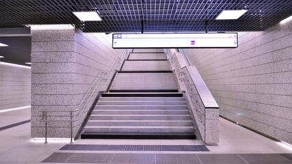 Obraz premium Modern interior design and lighting of metro station corridor. 