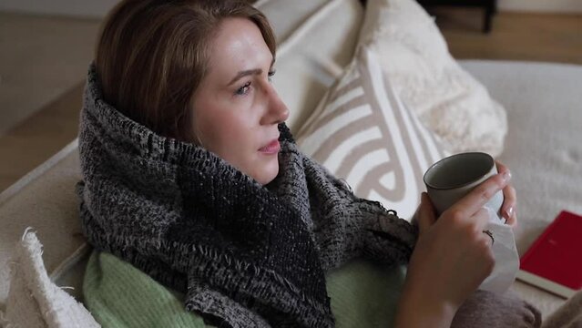 Woman sick on the couch