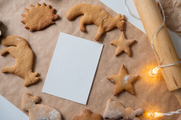 Frame of ginger cookies of different shapes on parchment