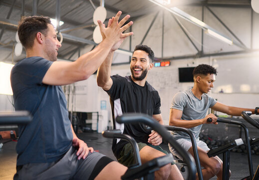 Fitness, man and high five at the gym for exercise, training or cardio workout together indoors. Happy men with smile and hands in celebration for partnership, support or sport motivation in wellness