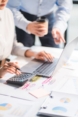 Group of business people meeting together Pointing to the graph assess business profits.