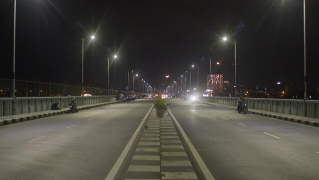 Surat Road, Centre Framed Traffic passing by at night skyline bridge